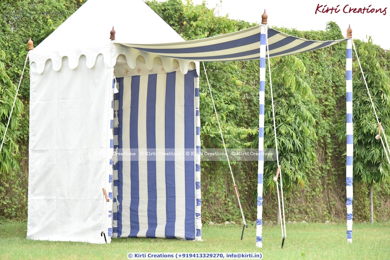 May include: A white and blue striped canopy tent with a white fabric roof. The tent is supported by four poles with white and blue stripes. The tent is set up in a grassy area.