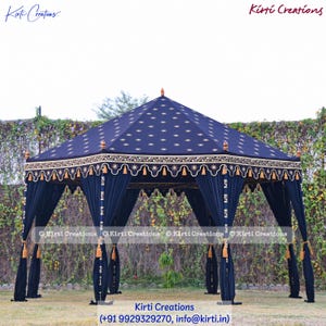 May include: A navy blue, octagonal tent with a star pattern on the roof. The tent has dark blue curtains and gold tassels. The text "Kirti Creations" is visible in the image.
