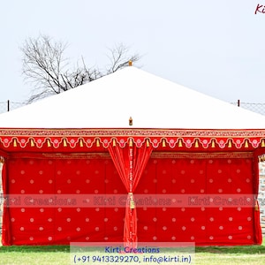 May include: A large rectangular event tent featuring a white peaked roof and vibrant red fabric walls adorned with a repeating white circular pattern. The tent has decorative red valances with gold tassels and draped red side curtains.