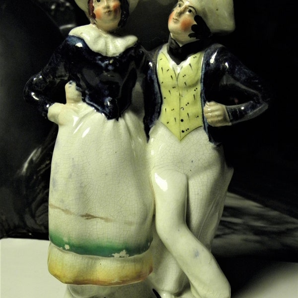 Antique 1800's Staffordshire Ceramic Figurine of Young Couple With Arms Around Each Other.