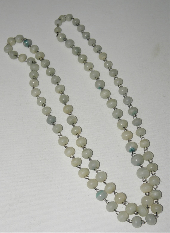 Long strand of light blue Agate Beads with Metal a