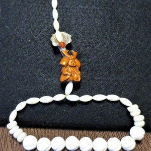 Unique Mala style Bracelet of carved Shell, Mother of Pearl with Boxwood Netsuke, Silver Flower and Carnelian Bead