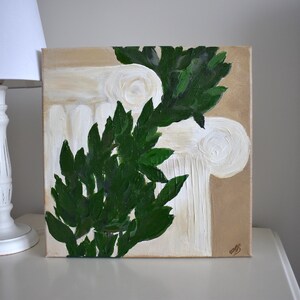 May include: A painting of a white column with green leaves painted on a beige background.