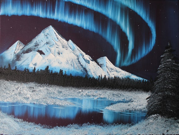 Glowing Northern Lights Over A Snow Covered Mountain And Etsy
