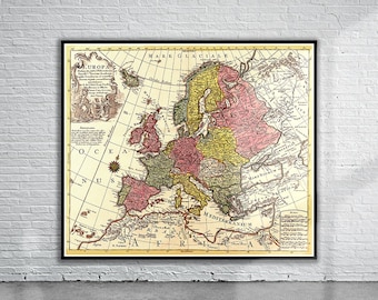May include: An antique map of Europe from the 18th century, showing the borders of various countries. The map is printed on paper and has a cream background with brown and red lines. The map is framed in black.