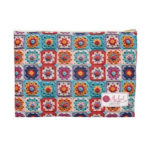 May include: A colorful crochet zippered pouch with a repeating pattern of squares. The pouch has a white background with a pink yarn ball logo that says "On the Hook Crochet".