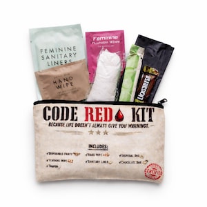 May include: A beige Code Red Kit with a black zipper, containing feminine hygiene products, a chocolate bar, and other essentials. The kit's text reads "Because life doesn't always give you warnings."