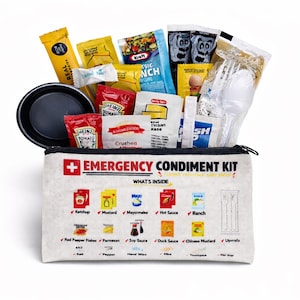 May include: An "Emergency Condiment Kit" with various condiment packets, a black bowl, and plastic utensils. The kit includes ketchup, mustard, mayonnaise, hot sauce, and ranch dressing. The kit's exterior is white with red and black text.