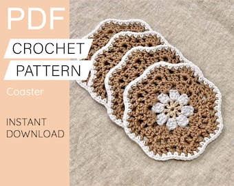 May include: Four crocheted coasters in brown and white with a flower design in the centre. The coasters are on a beige fabric background. The text "PDF CROCHET PATTERN Coaster INSTANT DOWNLOAD" is on the left side of the image. The text "Pattern and Craft" is at the bottom of the image.