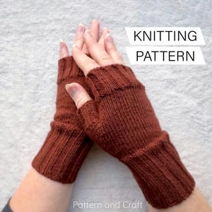 May include: A pair of knitted fingerless gloves in a warm brown hue. The gloves feature a ribbed cuff and a textured knit pattern. The image includes the text "KNITTING PATTERN" and "Pattern and Craft".