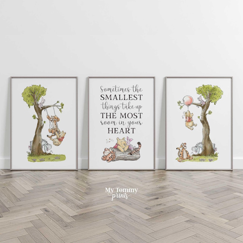 May include: Three framed wall art prints featuring Winnie the Pooh characters. The left print shows Pooh and Tigger on a swing in a tree. The center print displays the text Sometimes the SMALLEST things take up THE MOST room in your HEART. The right print shows Pooh holding a balloon.