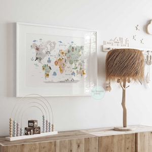 May include: A white framed world map print with illustrations of animals from different continents. The map is surrounded by a white border and the words "My Tommy Prints" are visible in the bottom right corner.