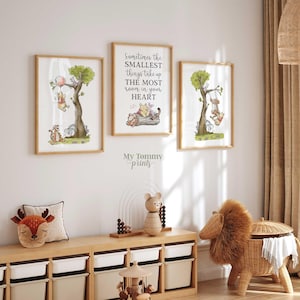 May include: Three framed wall art prints featuring Winnie the Pooh characters. The center print displays the text: Sometimes the SMALLEST things take up THE MOST room in your heart. The side prints show illustrations of characters in trees.