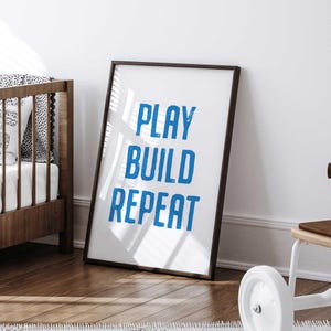 Blue and white “Play Build Repeat” wall art for boys room decor