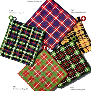 May include: Five crocheted pot holders in various plaid patterns. The pot holders are red, green, blue, yellow, and black. Each pot holder has a loop for hanging.