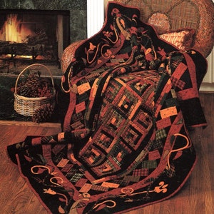 May include: A patchwork quilt with a black background and red, green, and brown squares. The quilt is folded over a wicker chair and draped on the floor in front of a fireplace.