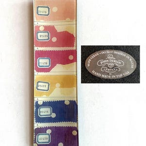 May include: A rectangular glass tray featuring six horizontal color swatches in peach, red, magenta, yellow, blue, and purple, each with white polka dots and a label numbered 22474 through 22479. An oval sticker reads John Derian Company.