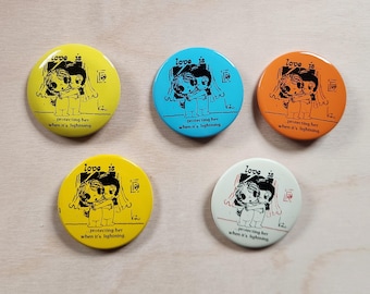 Love is... protecting her when it's lightning, By Kim, metal buttons,  SOLD INDIVIDUALLY, vintage, pins, circa 1970's