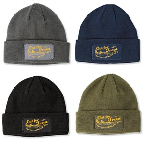 May include: Four knit beanies in different colors: gray, navy blue, black, and olive green. Each beanie features a patch with a stylized trout and the text "Out for Trout" in yellow.