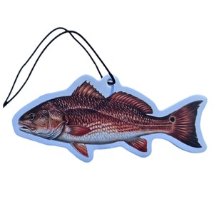 May include: A fish-shaped air freshener with a detailed illustration of a redfish. The air freshener has a light blue border and a black string for hanging. The fish is primarily red and brown with white accents.