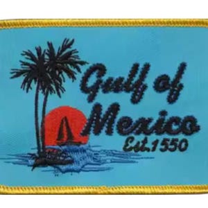 May include: A blue and yellow embroidered patch with a sunset, palm trees, and the text "Gulf of Mexico Est. 1550".