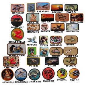 May include: A collection of colorful embroidered patches featuring various hunting and fishing themes. The patches depict animals, landscapes, and hunting and fishing equipment. Some of the patches include text such as "Pheasant", "Bass", "Sunset Hunt", "Circle Shells", "Marsh Dog", "Trout", "Hunt Dog", "Pike", "Walleye", "Duck", "Autumn Dog", "Circle Marlin", "Circle Bass", "Blaze Hunt", "Wood Duck", and "Trout Fly".