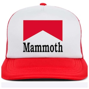 May include: A red, white, and black trucker hat with the word "Mammoth" in black block letters. The hat features a red brim and a white front panel with a red graphic. The back of the hat is red mesh.