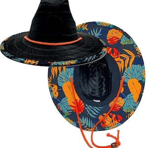 May include: A black straw hat with a wide brim and a black band around the crown. The hat has a tropical print on the underside of the brim, featuring orange, blue, and green leaves.
