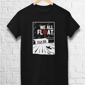 May include: Black t-shirt with a white graphic of a red balloon and the text "We All Float Down Here".