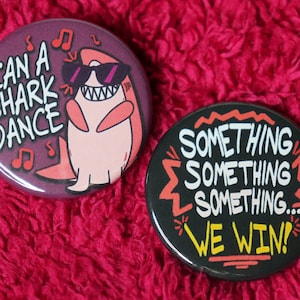 Can a Shark Dance and Something Something We Win Pin | Nimona Inspired Buttons
