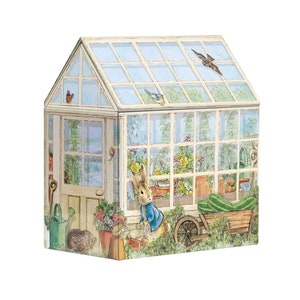 May include: A white and green greenhouse with a glass roof and a wooden door. A rabbit wearing a blue jacket is standing in front of the greenhouse. There are flowers and plants inside the greenhouse.