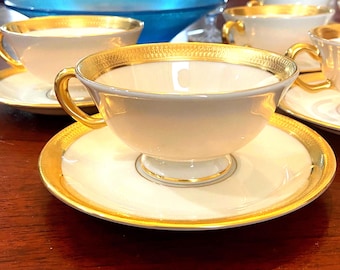 Pairs 24 kt gold Presidential footed teacup and saucer sets in ivory/cream color; brilliant shining gold bands, Lenox Lowell bone china MINT