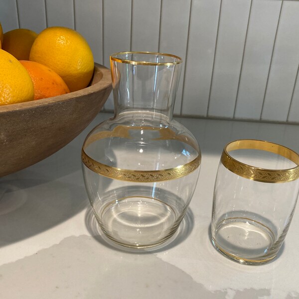 Gold rimmed bedside carafe and drinking glass