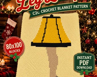 May include: A crochet blanket pattern featuring a vintage leg lamp design. The blanket is primarily yellow with a black and yellow lamp shade, a tan lamp base, and a black shoe. The text "Vintage Leg Lamp" is at the top.
