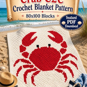 May include: A cream-colored crochet blanket featuring a large red crab design. The blanket is made with 80x100 blocks and is displayed on a sandy beach. The image also includes a straw hat, sunglasses, and a tote bag.