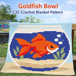 May include: A crocheted blanket featuring a goldfish in a bowl design. The blanket has a blue background with an orange goldfish, green plants, and white bubbles. The text "Goldfish Bowl C2C Crochet Blanket Pattern" is at the top.