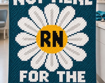May include: A rectangular crochet blanket with a dark teal background featuring a large white daisy with a yellow center. The text "NOT HERE" is in white at the top, "RN" is in black in the center, and "FOR THE DAISY" is in white at the bottom.