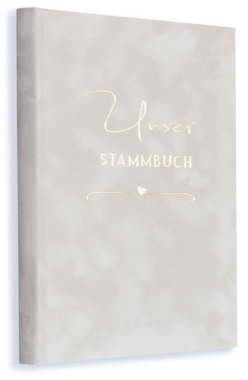 May include: A light gray book cover with the text "Unser Stammbuch" in gold lettering. A small heart symbol is below the text.