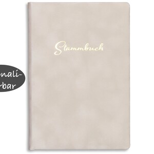 May include: A light beige leather-bound journal with the word "Stammbuch" embossed in gold lettering. The journal is personalized.