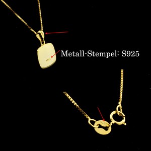 May include: A gold chain necklace with a pendant that has the inscription "S925" on it. The chain has a lobster clasp closure. The pendant is a rectangular shape with rounded corners.