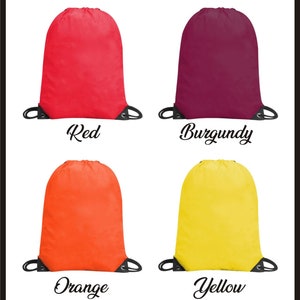 May include: Four drawstring bags in different colors: red, burgundy, orange, and yellow. The bags are made of a lightweight fabric and have a simple design.