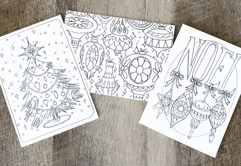 May include: Three black and white printable coloring pages featuring Christmas themes. The first page shows a Christmas tree with ornaments. The second page shows a pattern of Christmas ornaments. The third page shows the word "NOEL" with ornaments.