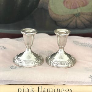 May include: A rustic wooden sign with the text "Welcome to our home" in a handwritten style. The sign features a distressed finish and a simple, inviting design, perfect for a front porch or entryway.