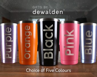 May include: Five stainless steel tumblers with different colored finishes: purple, orange, black, pink, and blue. Each tumbler has the color name printed in white on the side. The text "GIFTS BY dewalden" is printed above the tumblers. The text "Choice of Five Colours" is printed below the tumblers.