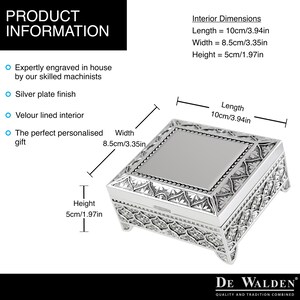 May include: Silver-plated jewelry box with an ornate design. The box has a velvet-lined interior and measures 3.94 inches long, 3.35 inches wide, and 1.97 inches high.  "DE WALDEN QUALITY AND TRADITION COMBINED" is printed on the bottom of the box.