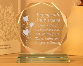May include: A clear glass octagon-shaped award with a beveled edge and a green base. The award is engraved with the text "Happy 40th Anniversary Mum & Dad 6th September 2025 Lots of love from Rosie, Cameron, Harper & Amelia".