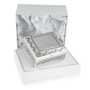 May include: A silver-colored, ornate jewelry box with a hinged lid. The lid is engraved with the message "Happy 18th Birthday Jennifer Marie Lots of love always From Mummy & Daddy xxx". The box is sitting inside a white box with a satin lining.