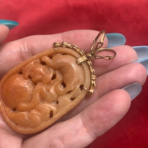 Vintage 14k gold and carved red jade pendant with double lock