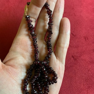Beautiful free form dark red Garnet beaded necklace with 14 karat gold clasp