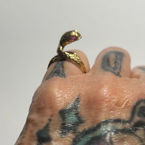 Vintage size 5 snake ring in 14 karat gold featuring Ruby stones
